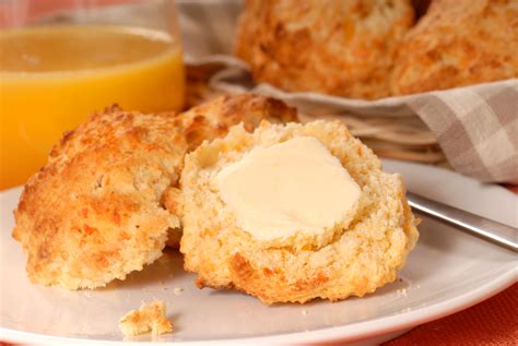 Buttered biscuit - Ree ups the flavor of these extra-buttery biscuits by adding garlic and rosemary before they bake!#ReeDrummond #ThePioneerWoman #FoodNetwork #BiscuitsWatch #...